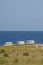 MULTIPLE OLD CARAVANS CAMPING AT THE SEA COAST