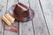 Multiple pipes pan flute and leather cowboy hat lying on square-edged flooring, copyspace