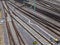 Multiple railroad tracks with junctions at a railway station in a perspective view