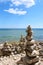 Multiple rock totems along the rocky shoreline of Lake Michigan in Sturgeon Bay, Wisconsin