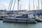 Multiple sailing boats of various shapes and sizes moored in the tourist port of Viareggio in Tuscany