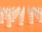 Multiple single color white soda bottle in a row on yellow orange background, flat colors, single color cola bottles, 3d rendering