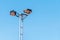 Multiple spotlights with blue background illuminating the sports field