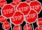 Multiple stop sign against black background