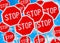 Multiple stop sign against blue sky background