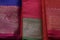 multiple varieties of handwoven silk sarees in vibrant colors