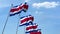 Multiple waving flags of Costa Rica against the blue sky