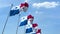 Multiple waving flags of Panama against the blue sky