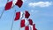 Multiple waving flags of Peru against the blue sky. 3D rendering