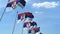 Multiple waving flags of Serbia against the blue sky. 3D rendering