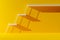 Multiple white stairs on yellow background, success, achievement or career opportunity concept