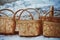 Multiple wooden baskets placed on snow covered surface