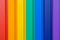 Multiples vertical color stripes on a metal wall -
