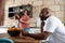 Multiracial african american family in their home kitchen with their dogmultiracial african american family in home kitchen with f