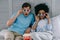 Multiracial boyfriend and girlfriend in stereoscopic glasses watching movie at home