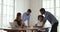 Multiracial business team brainstorm on paperwork at office meeting table