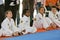 Multiracial children sitting on the mat