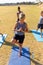 Multiracial elementary schoolboys practicing balancing exercise on school ground during sunny day