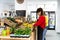 Multiracial employees working inside fruits market