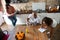 Multiracial family in the kitchen of their home sharing moments together