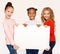 Multiracial girls holding blank banner for advertisement