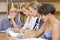 Multiracial group of four people studying library