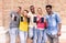 Multiracial group of friends showing blank smartphone screens outdoors - Young multi ethnic people having fun with mobile phones