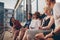 Multiracial group of friends sitting in balcony and smiling