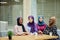 Multiracial group of muslim women dressed in national clothes posing in group