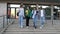 Multiracial happy college students walking down stairs together outside university building. People in college campus.