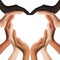 Multiracial human hands making a heart shape