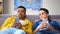 Multiracial male teenagers wasting time in social network, gadget influence