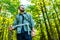 Multiracial pakistanian happy man walking alene at camping park forest