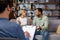 Multiracial quarrel between husband and wife at a session with a psychotherapist. A visit to a family psychologist for a