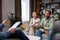 Multiracial quarrel between husband and wife at a session with a psychotherapist. A visit to a family psychologist for a