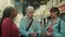 Multiracial senior people talking while waiting at the bus station