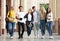 Multiracial students walking after classes in university campus