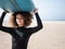 Multiracial surfer young woman on the beach