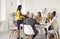 Multiracial team of business people having a work meeting around the office table