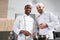 Multiracial team of male cooks working together