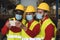 Multiracial teamwork having fun taking selfie while working in warehouse wearing face mask during corona virus outbreak