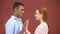 Multiracial teen boy and girl touching hands, first warm feelings, affection