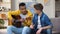 Multiracial teenage friends preparing for contest playing guitar musician career