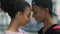 Multiracial teens couple touching foreheads, enjoying perfect date, first love