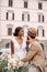 Multiracial wedding couple. Wedding in Florence, Italy. African-American bride in a white dress with a long veil and a