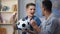 Multiracial young friends cheering, favorite football team scoring goal, leisure