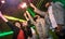 Multiracial young friends dancing at night club with sparkler fireworks - Happy people having crazy fun at nightclub after party