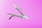 Multitool is a multi-functional tool on a pink background. The concept of an open, flying multi-tool with free space