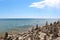 A multitude of cairns lining the rocky shoreline of Lake Michigan in Cave Point County Park