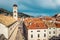 Multitude of tourists visit the Old City of Dubrovnik and the famous street Stradun